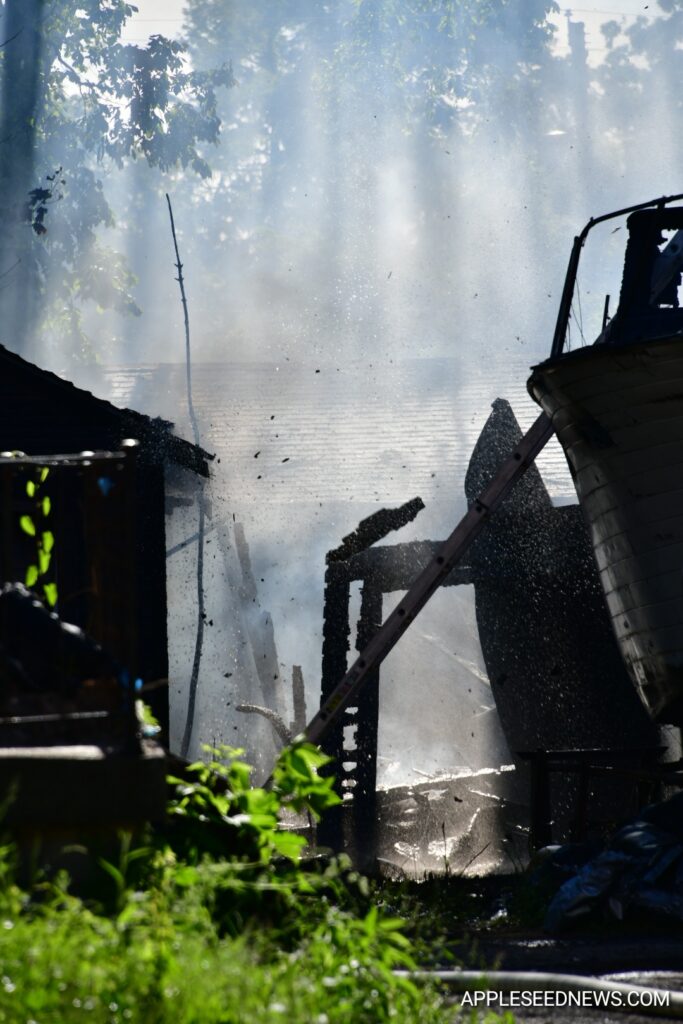 Fire Destroys Garage and Boat on Helen Avenue; Investigation Underway 8